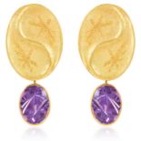 A PAIR OF AMETHYST EARRINGS, ZOBEL in 18ct yellow gold, each designed as a large 'yin/yang' motif,