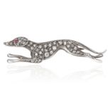 AN ANTIQUE DIAMOND AND RUBY GREYHOUND BROOCH in gold, depicting a greyhound, with round cut ruby eye
