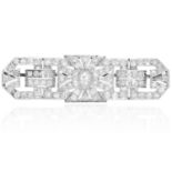 AN ART DECO DIAMOND BROOCH in platinum, the rectangular form jewelled with old cut diamonds in Art