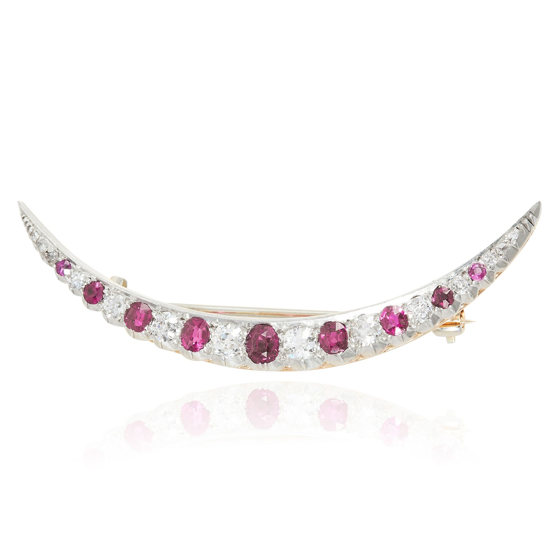 AN ANTIQUE RUBY AND DIAMOND CRESCENT BROOCH, 1897 in 18ct yellow gold and platinum, designed as a