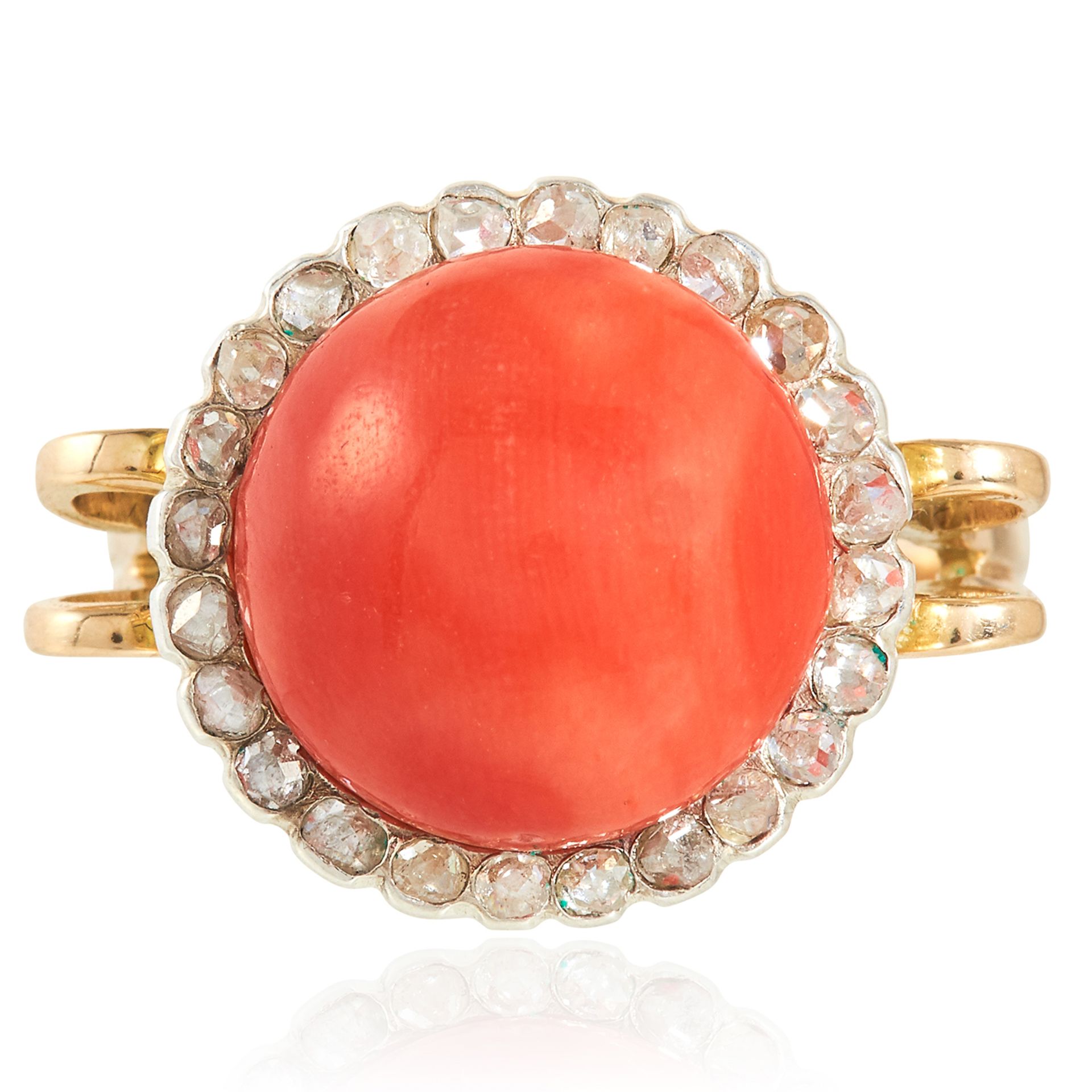 AN ANTIQUE CORAL AND DIAMOND RING in high carat yellow gold, the polished coral bead of 12.5mm
