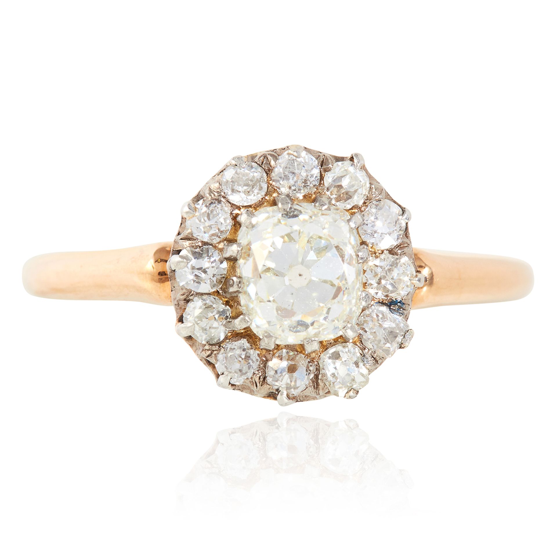 A 1.50 CARAT DIAMOND CLUSTER RING in yellow gold, set with an old cut diamond of approximately 0.