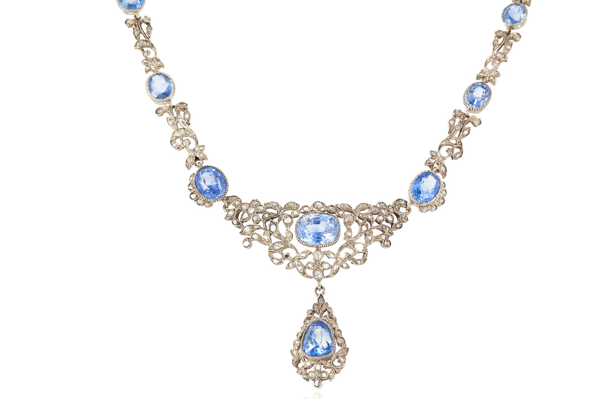 AN ANTIQUE CEYLON NO HEAT SAPPHIRE AND DIAMOND NECKLACE in yellow gold and platinum, the necklace
