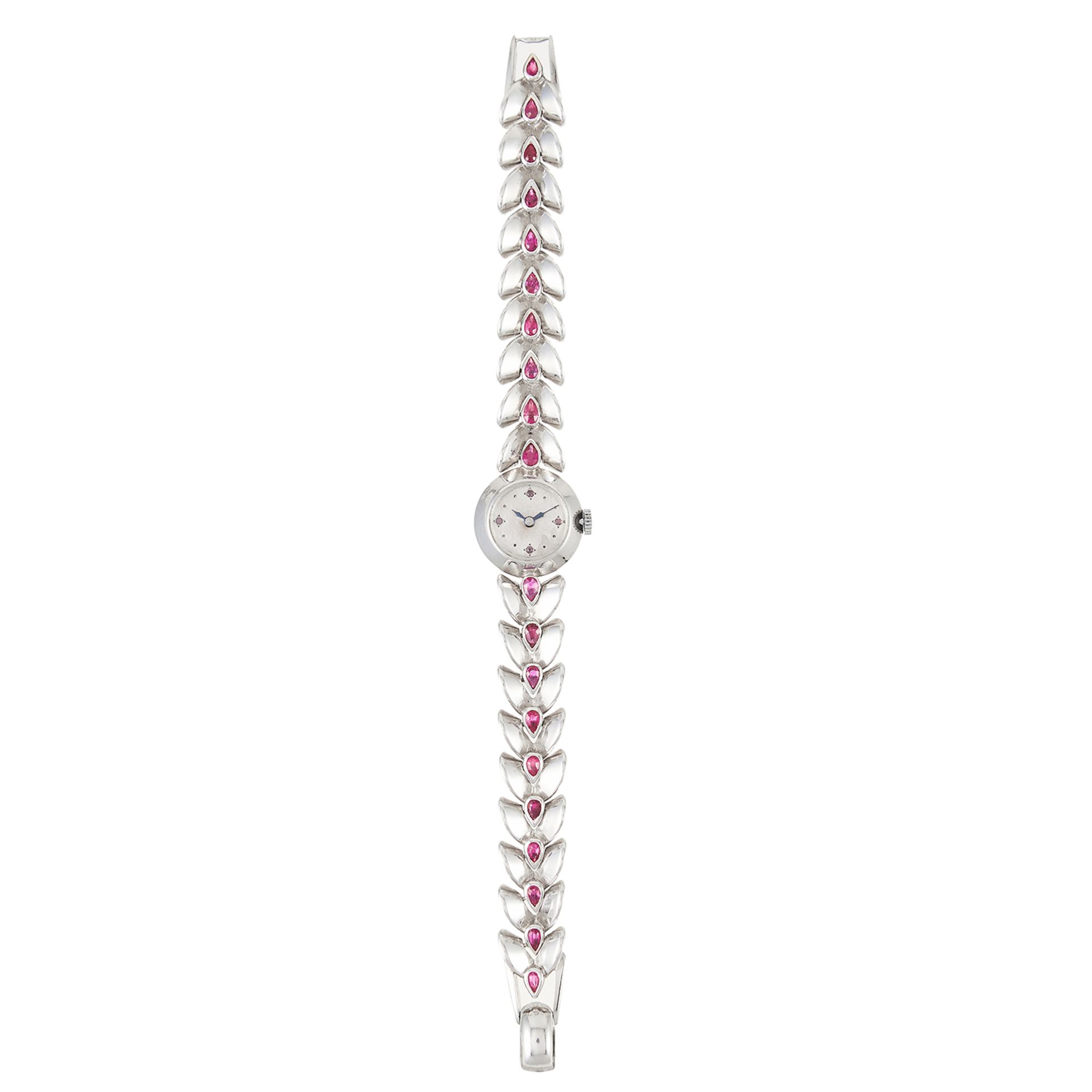 A RUBY LADIES WRISTWATCH, FRENCH in white gold, the fancy link chain is set with pear cut rubies and