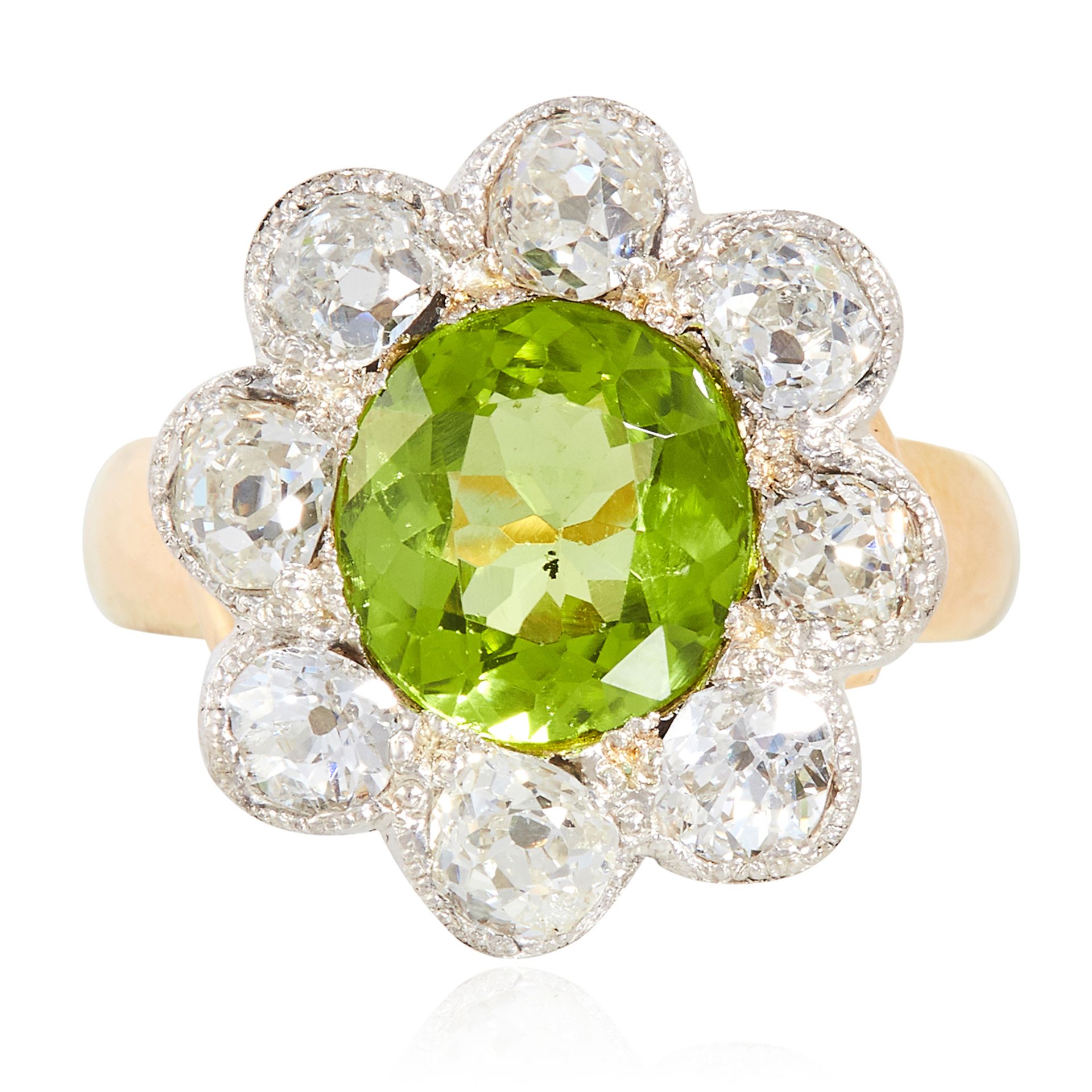 A PERIDOT AND DIAMOND CLUSTER RING in yellow gold, set with a round cut peridot of approximately 2.