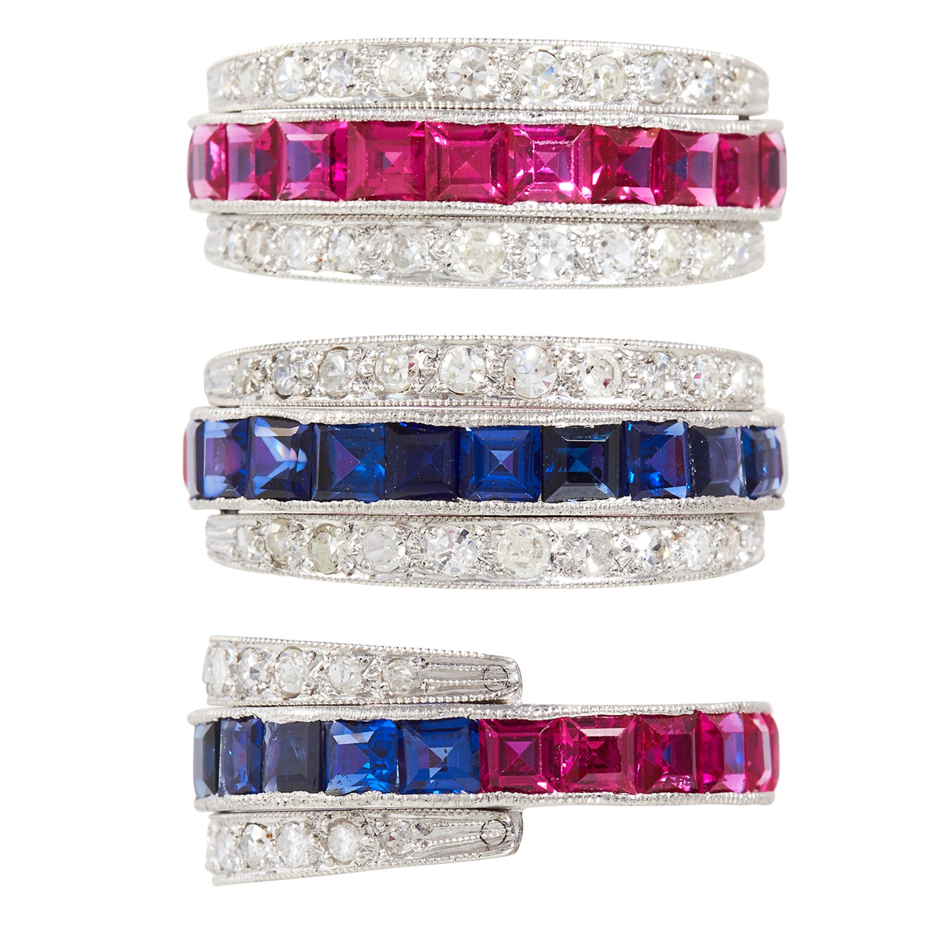 A SAPPHIRE, RUBY AND DIAMOND REVERSIBLE RING in platinum or white gold, the central band half set