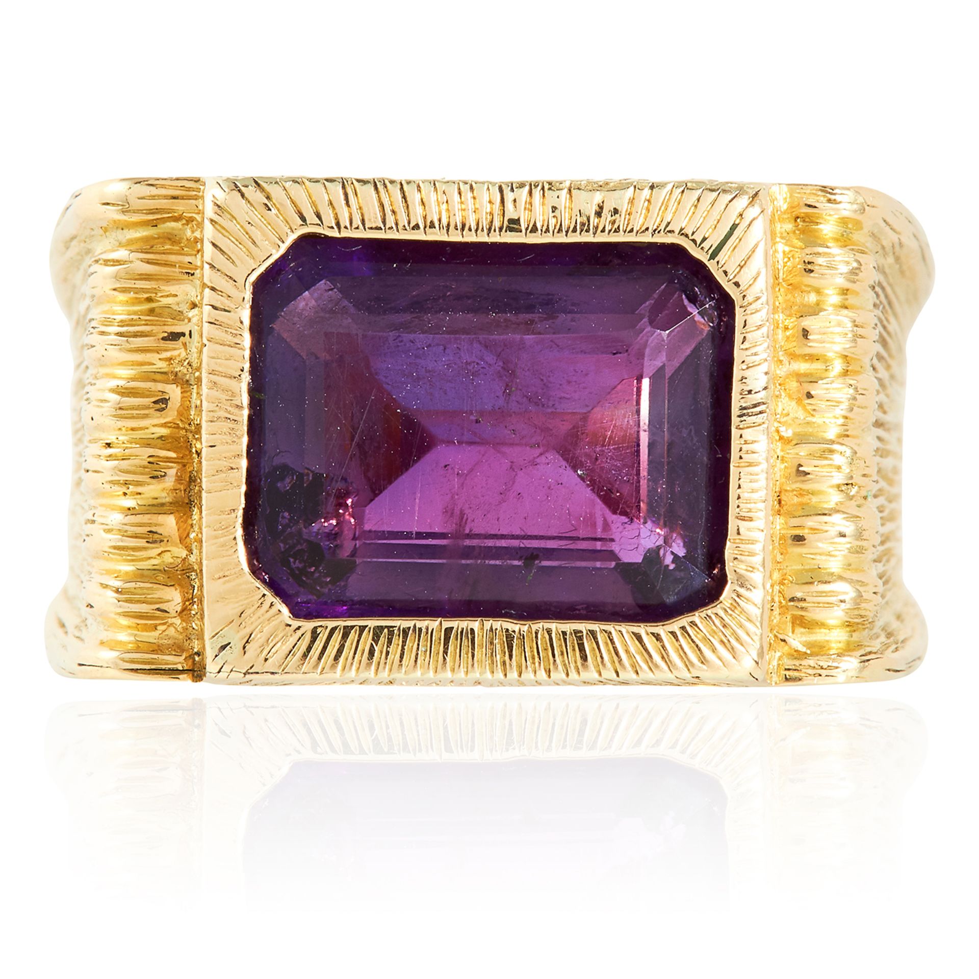 AN AMETHYST DRESS RING, KUTCHINSKY 1963 in 18ct yellow gold, the emerald cut amethyst set within a