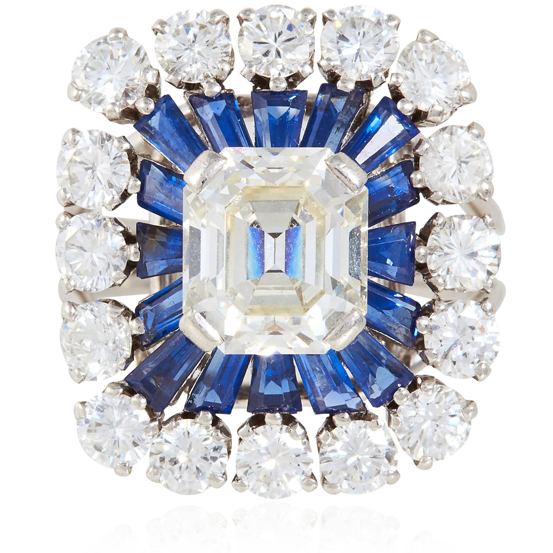 A SAPPHIRE AND DIAMOND DRESS RING in platinum, the central emerald cut diamond of approximately 2.45
