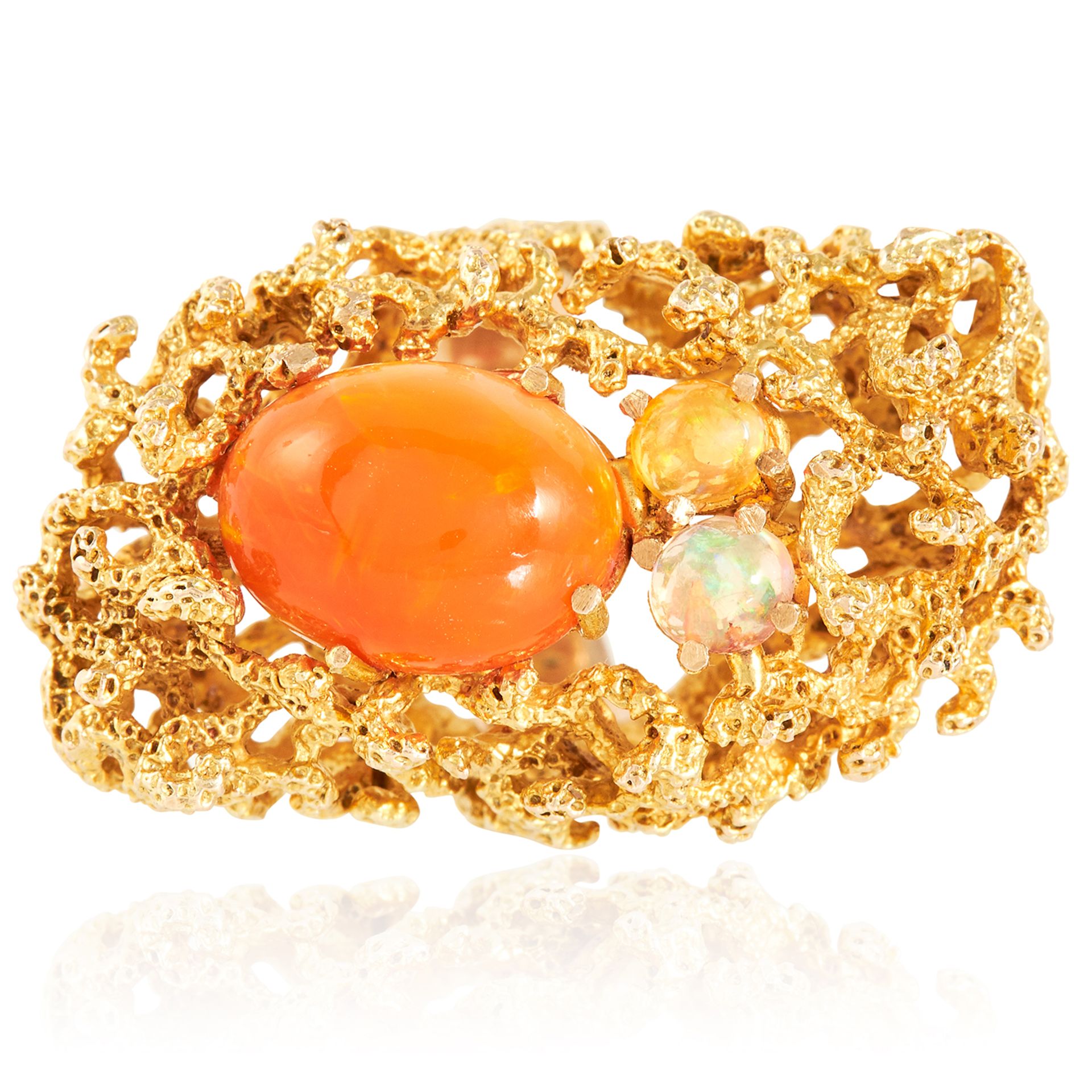 A VINTAGE FIRE OPAL AND OPAL COCKTAIL RING in high carat yellow gold, set with a trio of cabochon