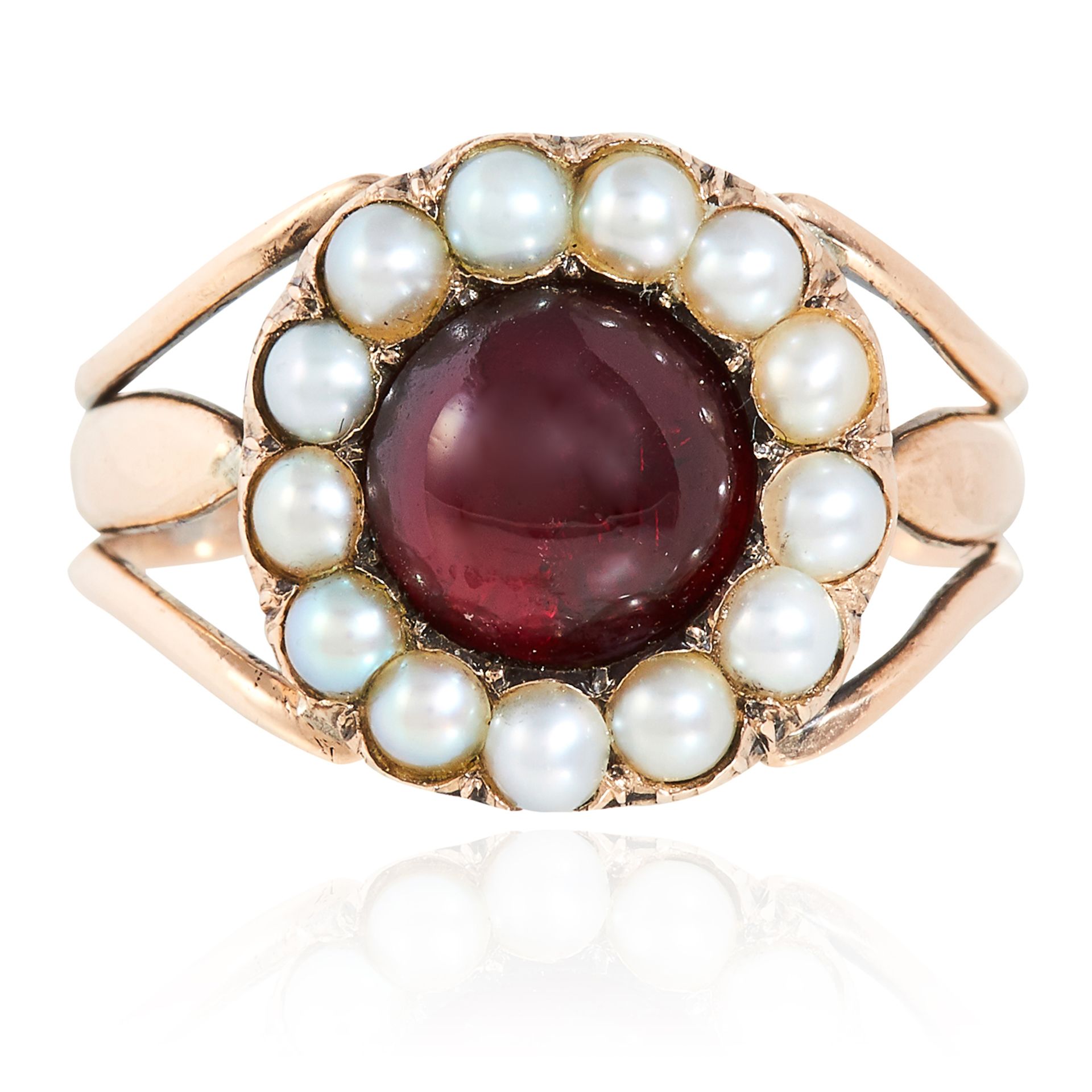 AN ANTIQUE GEORGIAN GARNET AND PEARL MOURNING RING, 1806 in high carat yellow gold, the round