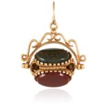 A HARD STONE FOB in yellow gold, set with carnelian, onyx and bloodstone on articulated fob,