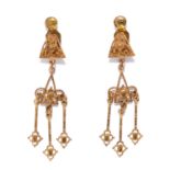 A PAIR OF GOLD EARRINGS in scrolling design, each suspending three gold tassels, unmarked, 4.31g.