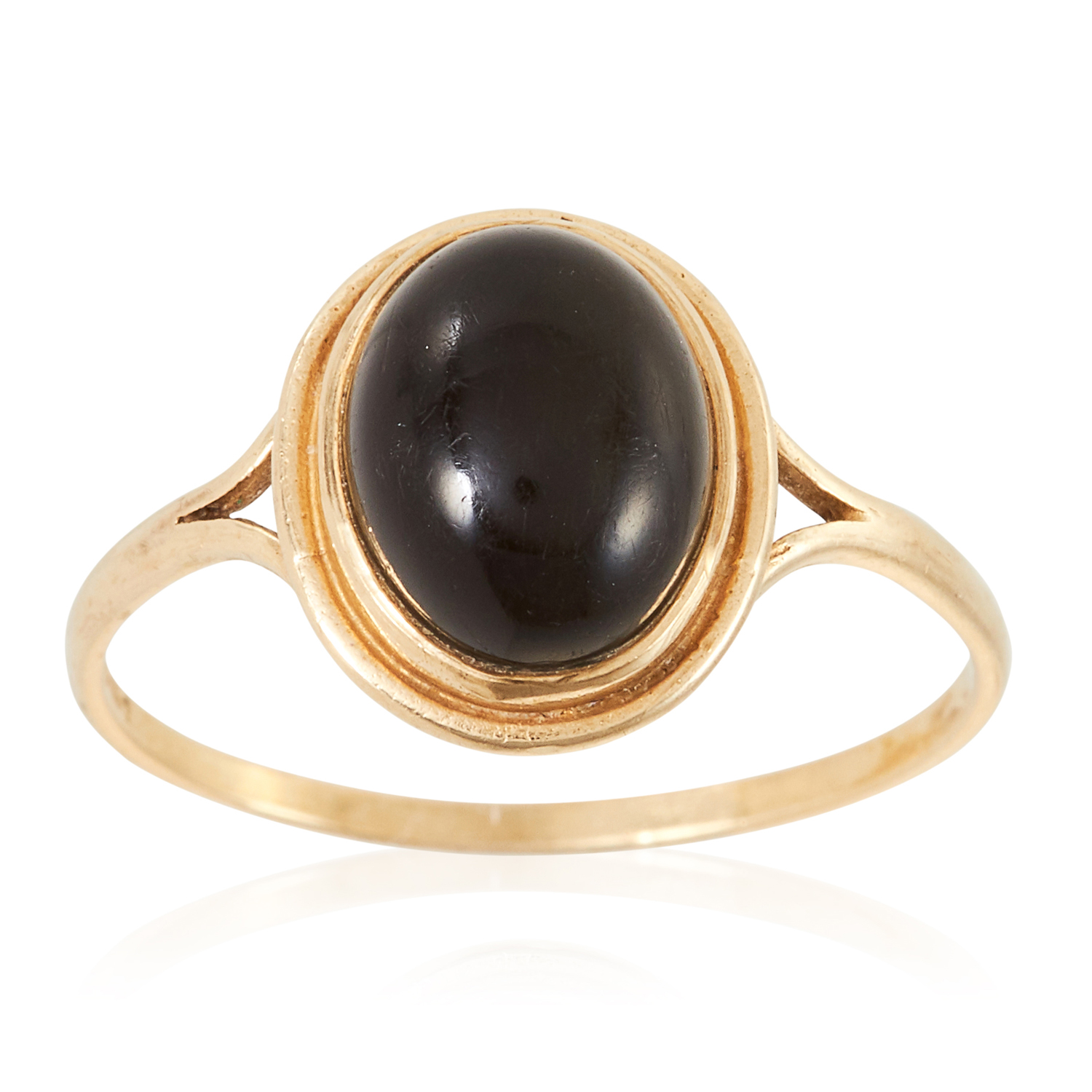 A GEMSET RING in yellow gold, set with a cabochon green stone, British hallmarks, size S / 9, 1.6g.