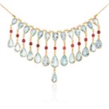 AN AQUAMARINE AND RUBY NECKLACE in 14ct yellow gold, comprising of thirteen tassels of pear cut