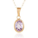 AN AMETHYST PENDANT in yellow gold, set with an oval cut amethyst, stamped 375, 0.6g.