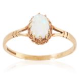 AN OPAL DRESS RING in yellow gold, set with a cabochon opal, British hallmarks, size Q / 8, 1.5g.