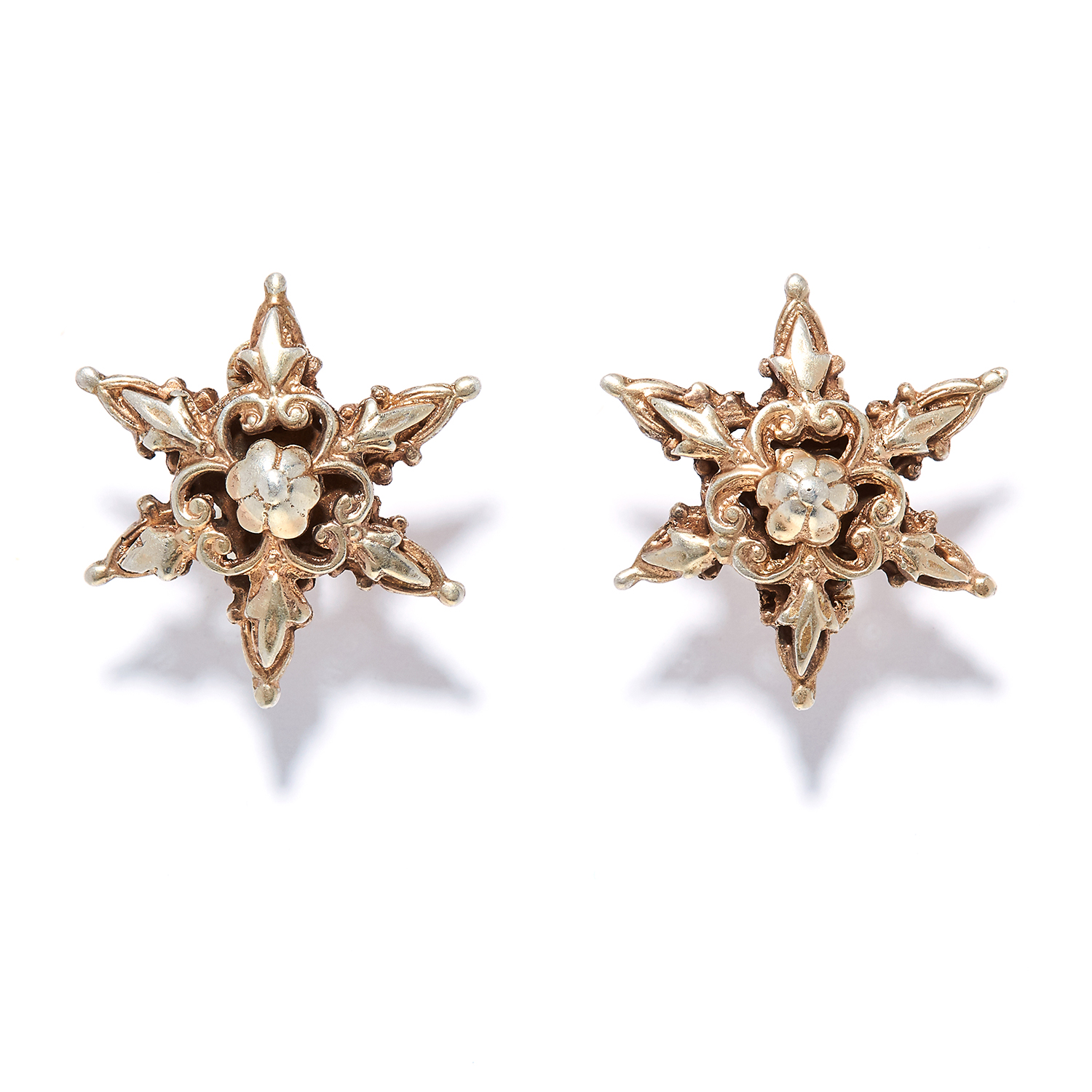 A PAIR OF SILVER EARRINGS in sterling silver, in star design, decorated with foliate motifs,