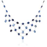 A SAPPHIRE NECKLACE in 14ct white gold, comprising of a single row of oval cut sapphires