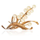 A PEARL BROOCH in 14ct yellow gold, in abstract foliate design, set with eleven pearls, stamped 14K,