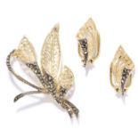 A MARCASITE BROOCH AND EARRING SUITE in silver, in scrolling and foliate design set with