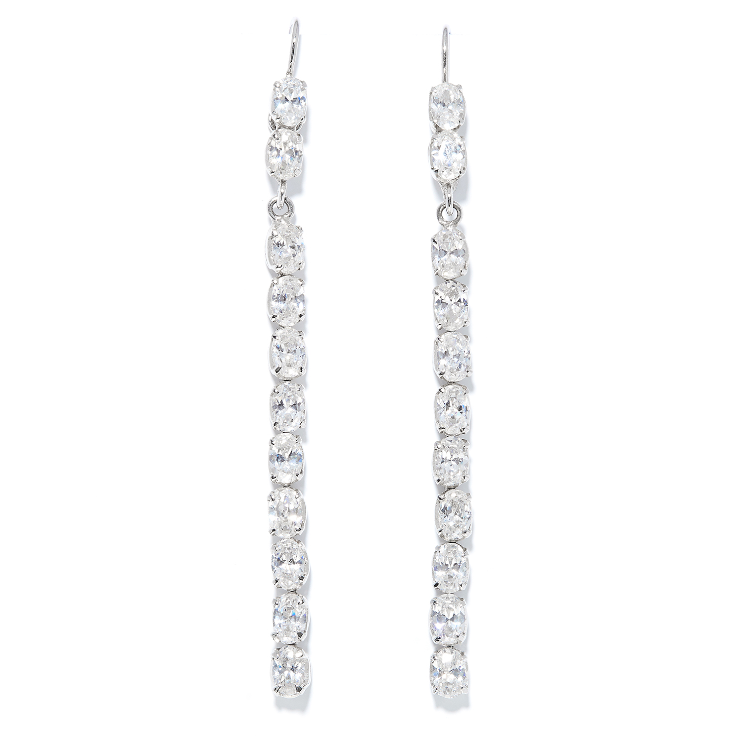 A PAIR OF WHITE STONE EARRINGS in white metal, each comprising of a line of oval cut white stones,