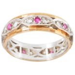 A RUBY AND DIAMOND ETERNITY RING in yellow gold, set with alternating round cut diamonds and rubies,