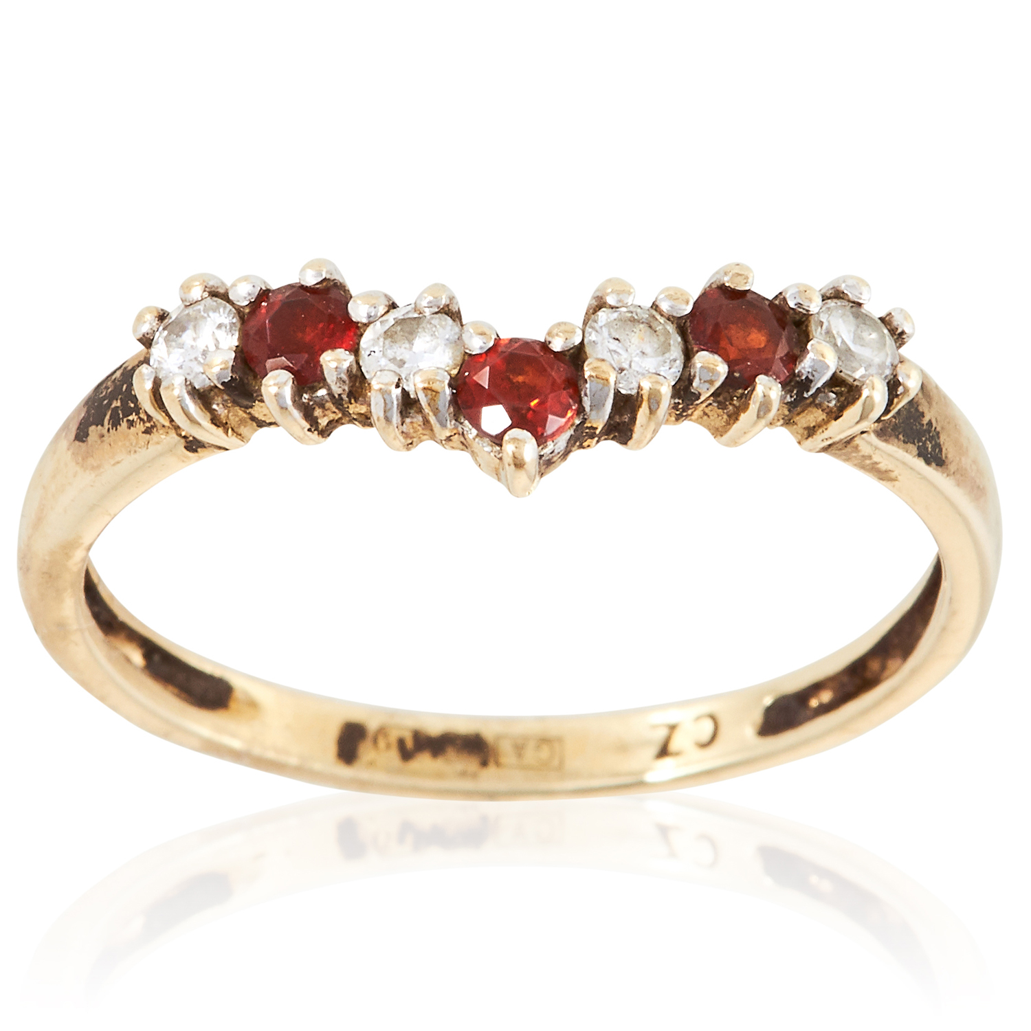 A GEMSET RING in yellow gold, set with alternating round cut red and white gemstones, unmarked, size