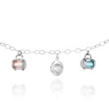 A SILVER CHARM BRACELET set with a hat charm and two handbag charms, stamped 925, 18cm, 18.43g.