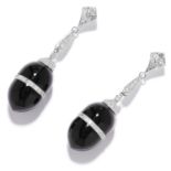 ONYX AND DIAMOND EARRINGS in platinum or white gold, the polished onyx with a central band of