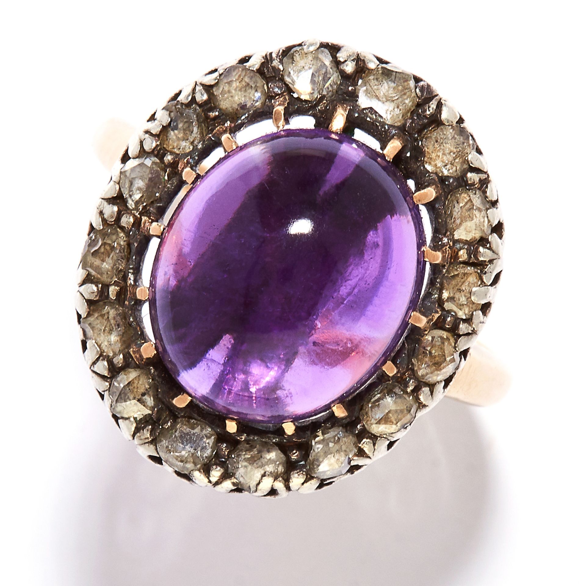 ANTIQUE AMETHYST AND DIAMOND RING in high carat yellow gold and silver, the oval cabochon amethyst