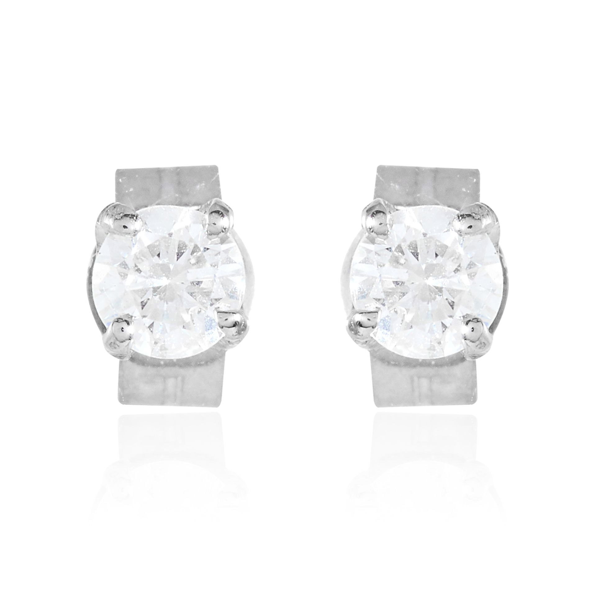 A PAIR OF 0.32 CARAT DIAMOND EAR STUDS in 18ct white gold, each set with a round cut diamond