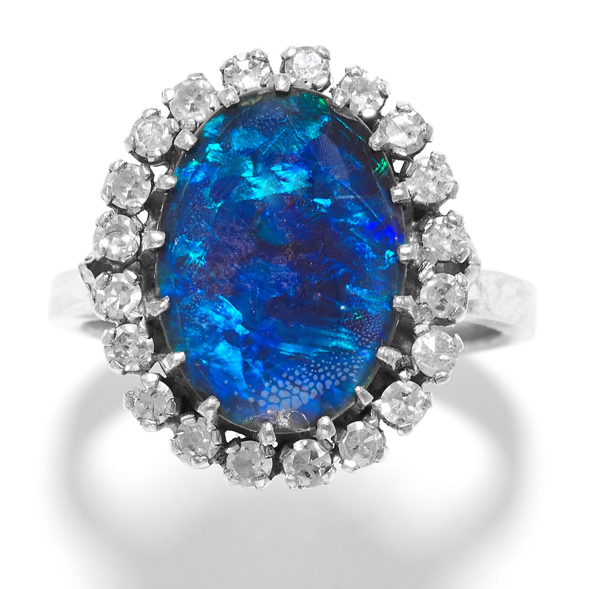 BLACK OPAL AND DIAMOND CLUSTER RING in 18ct white gold, set with a cabochon black opal doublet in