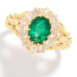 EMERALD AND DIAMOND CLUSTER RING in 18ct yellow gold, set with an oval cut emerald in a cluster of