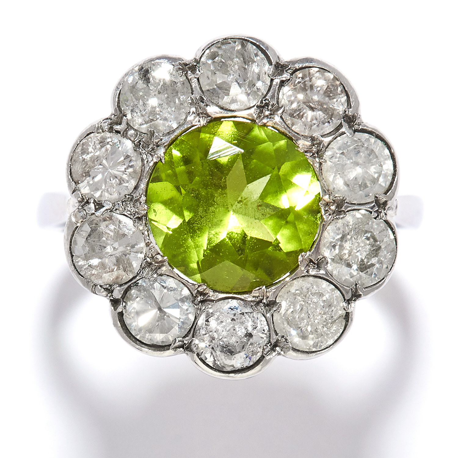 PERIDOT AND DIAMOND CLUSTER RING in platinum or white gold, the round cut peridot encircled by