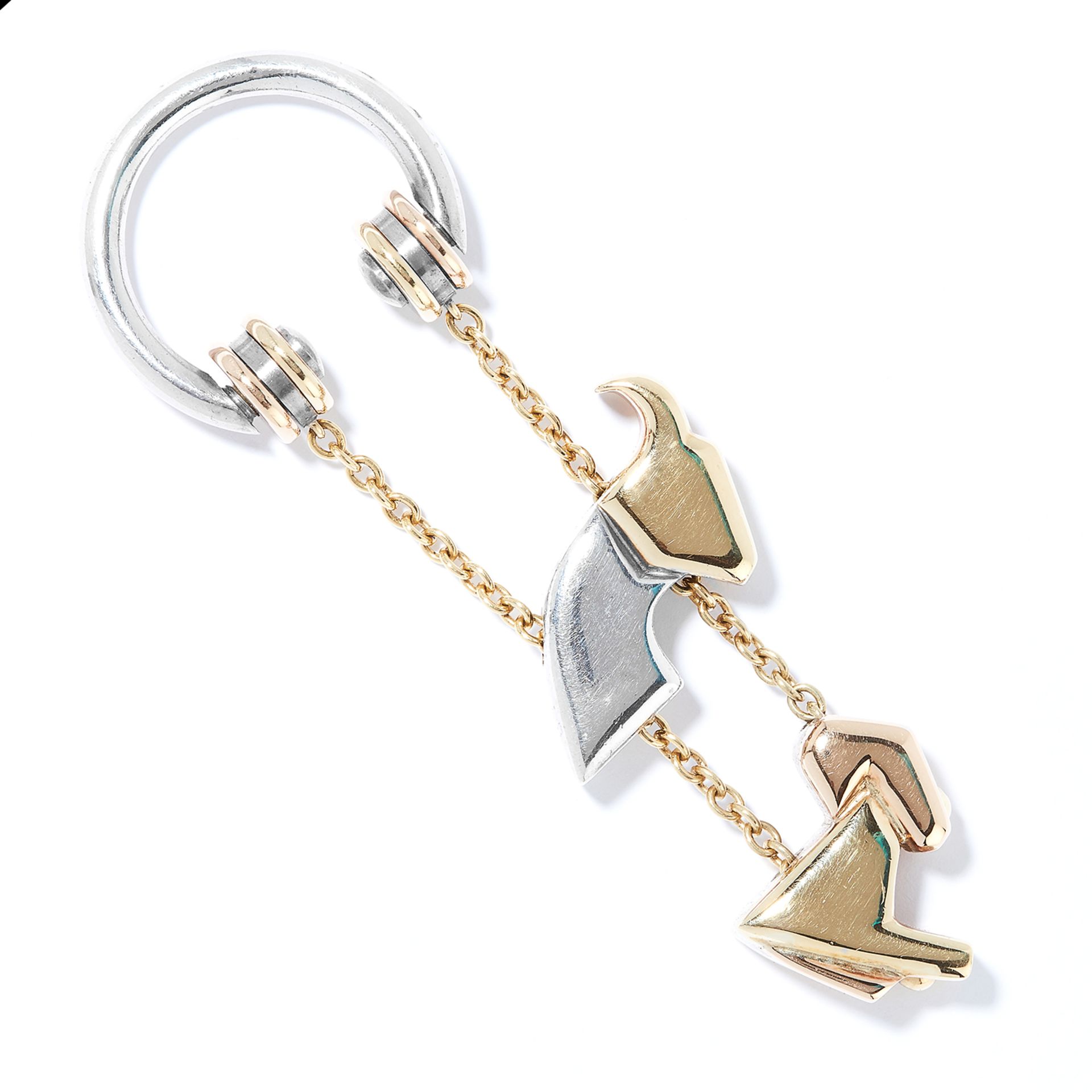 CARTIER KEY RING in silver and gold, designed as a rearing ram in two interlocking tricoloured