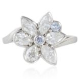 BLUE DIAMOND AND WHITE DIAMOND DRESS RING, HIRSH in platinum, depicting a flower set with two