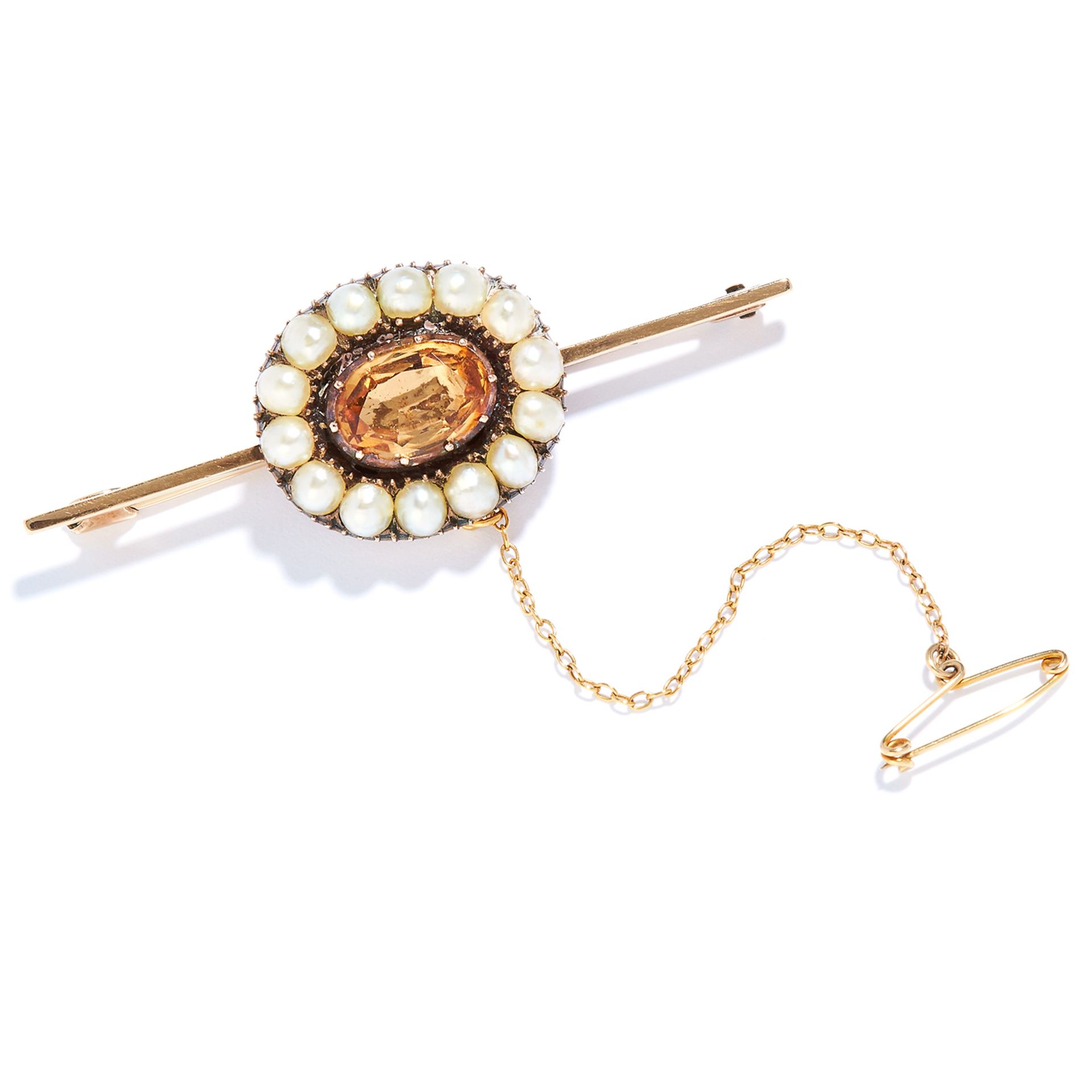 ANTIQUE IMPERIAL TOPAZ AND PEARL BAR BROOCH in high carat yellow gold, set with an oval cut topaz in