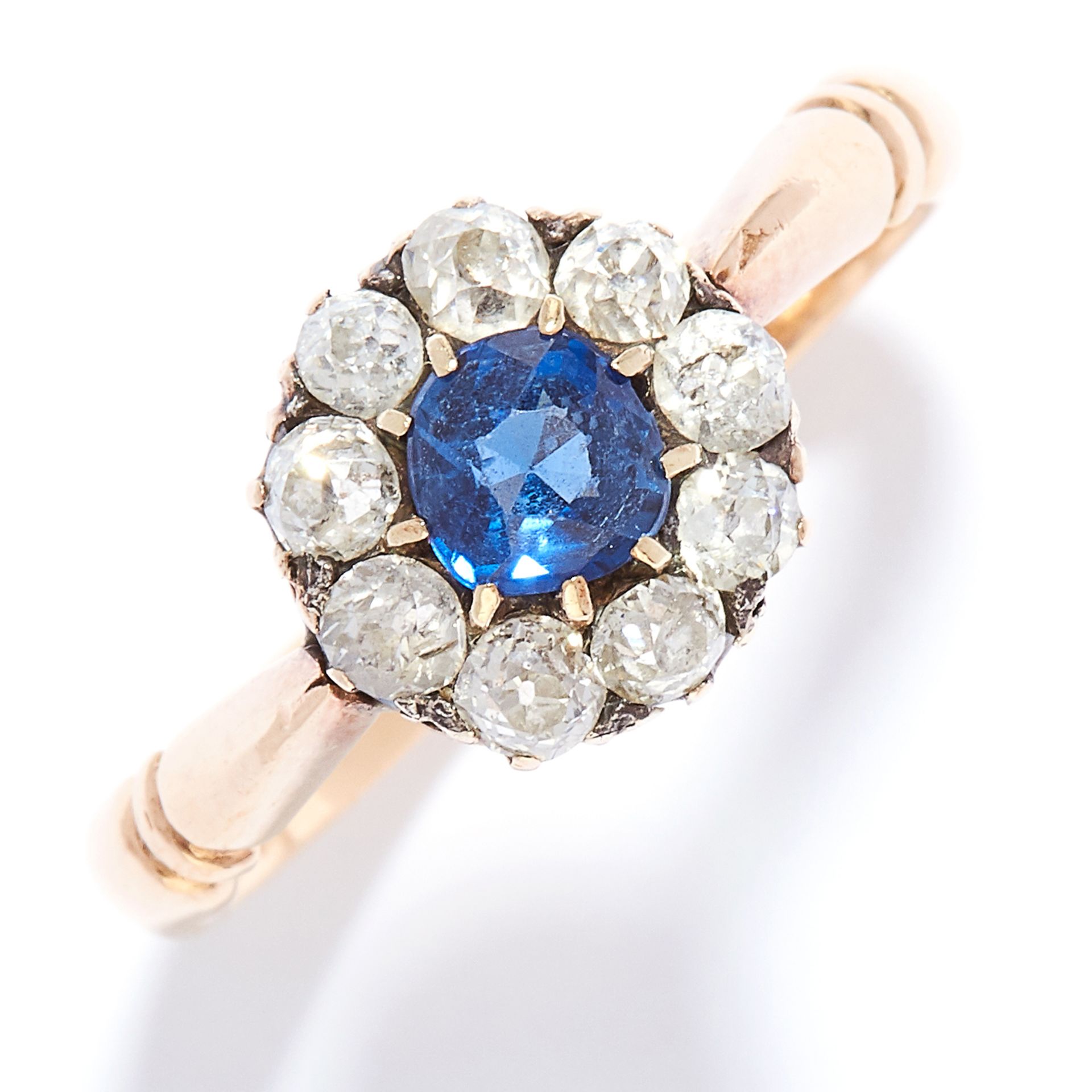 ANTIQUE SAPPHIRE AND DIAMOND CLUSTER RING, 1876 in 18ct yellow gold, set with a round cut sapphire