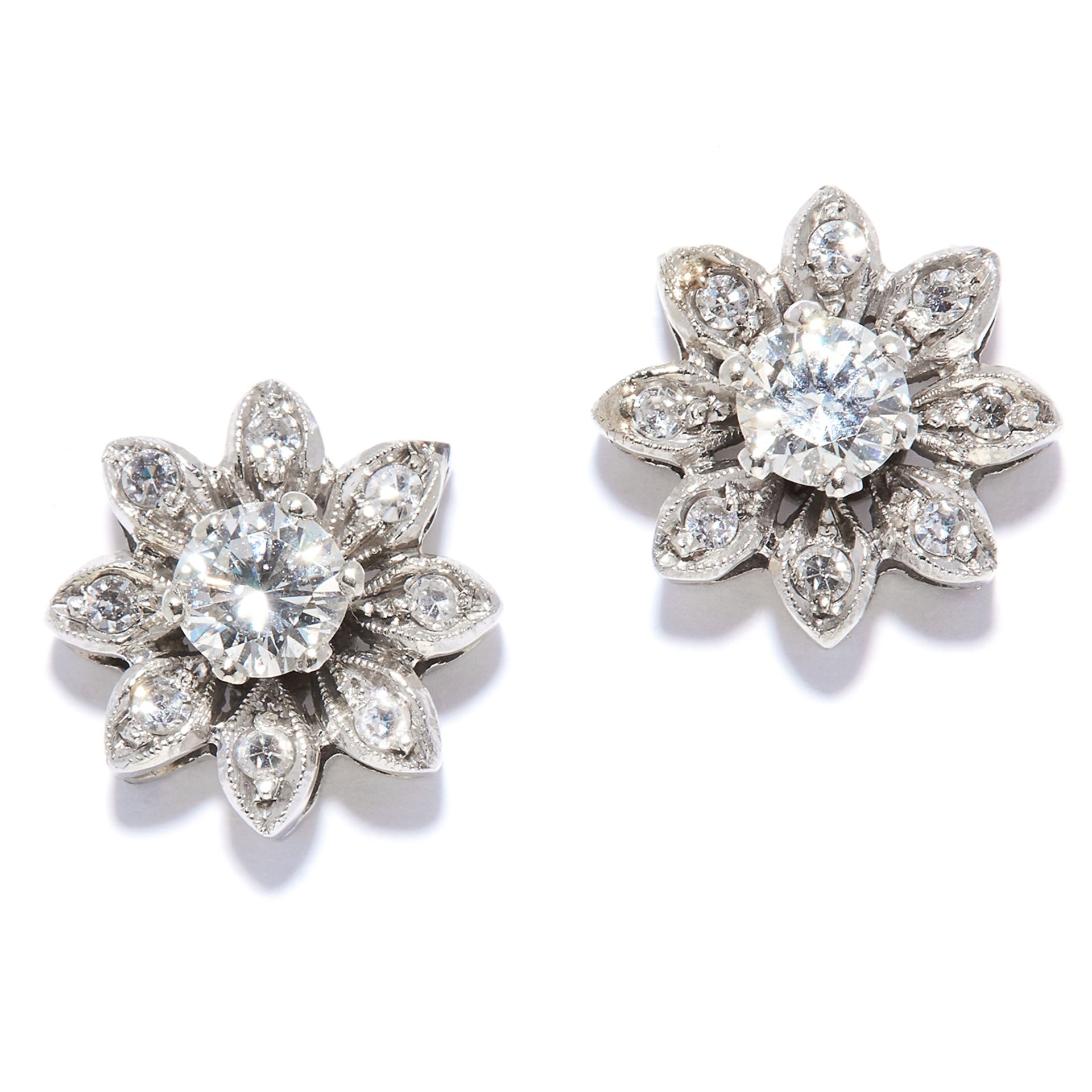 A PAIR OF DIAMOND CLUSTER STUD EARRINGS in 14ct white gold, each depicting a flower set with round