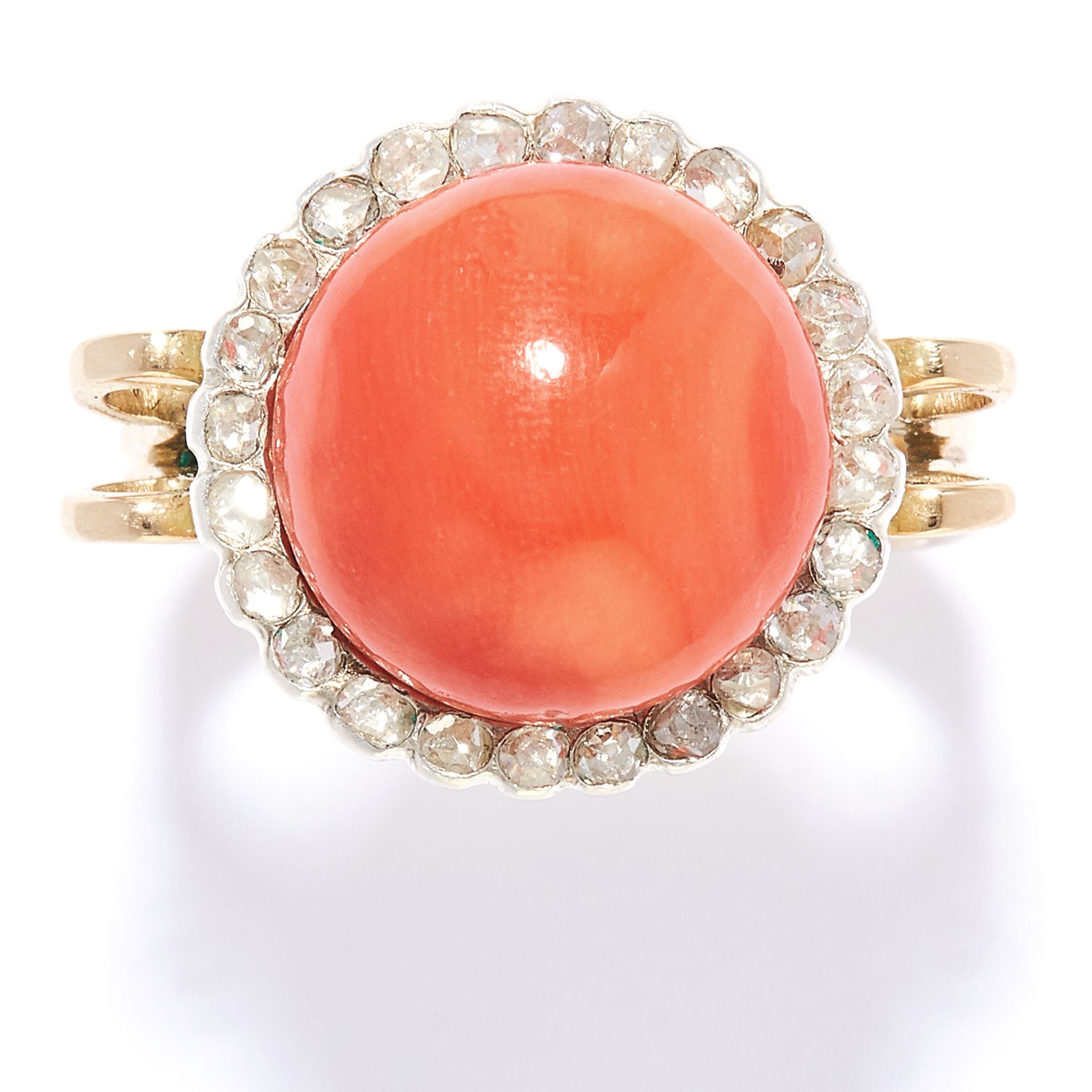 AN ANTIQUE CORAL AND DIAMOND RING in high carat yellow gold, the polished coral bead of 12.5mm