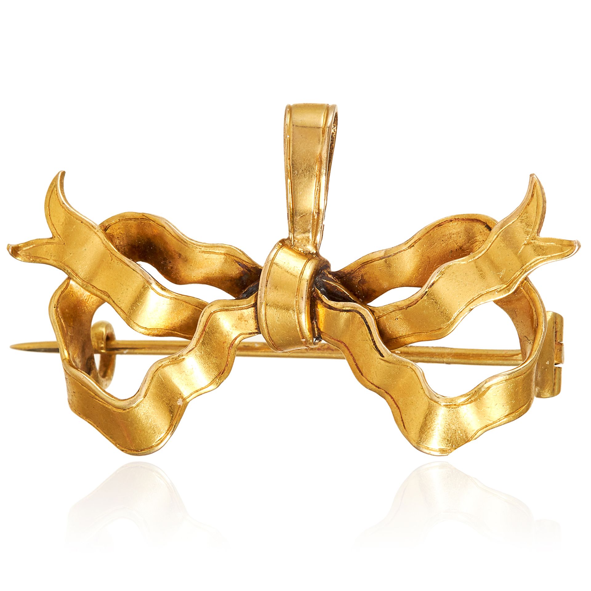 AN ANTIQUE RIBBON AND BOW BROOCH, 19TH CENTURY in high carat yellow gold, designed as a ribbon