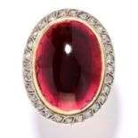 ANTIQUE GARNET AND DIAMOND RING in high carat yellow gold and silver, the large oval cabochon garnet