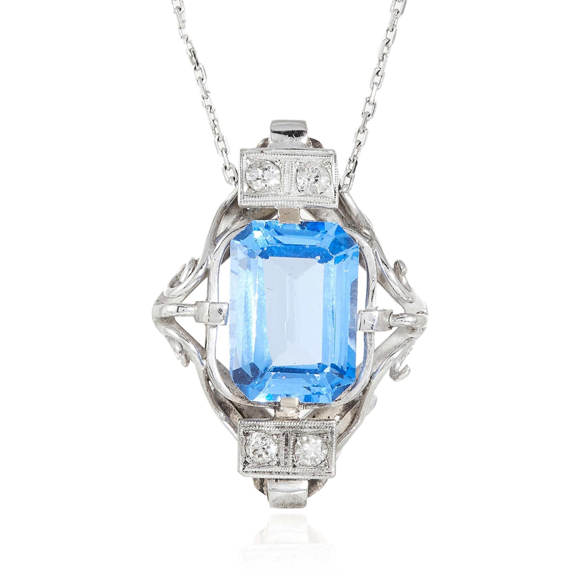 A BLUE STONE AND DIAMOND PENDANT in platinum or white gold, the emerald cut blue gemstone accented