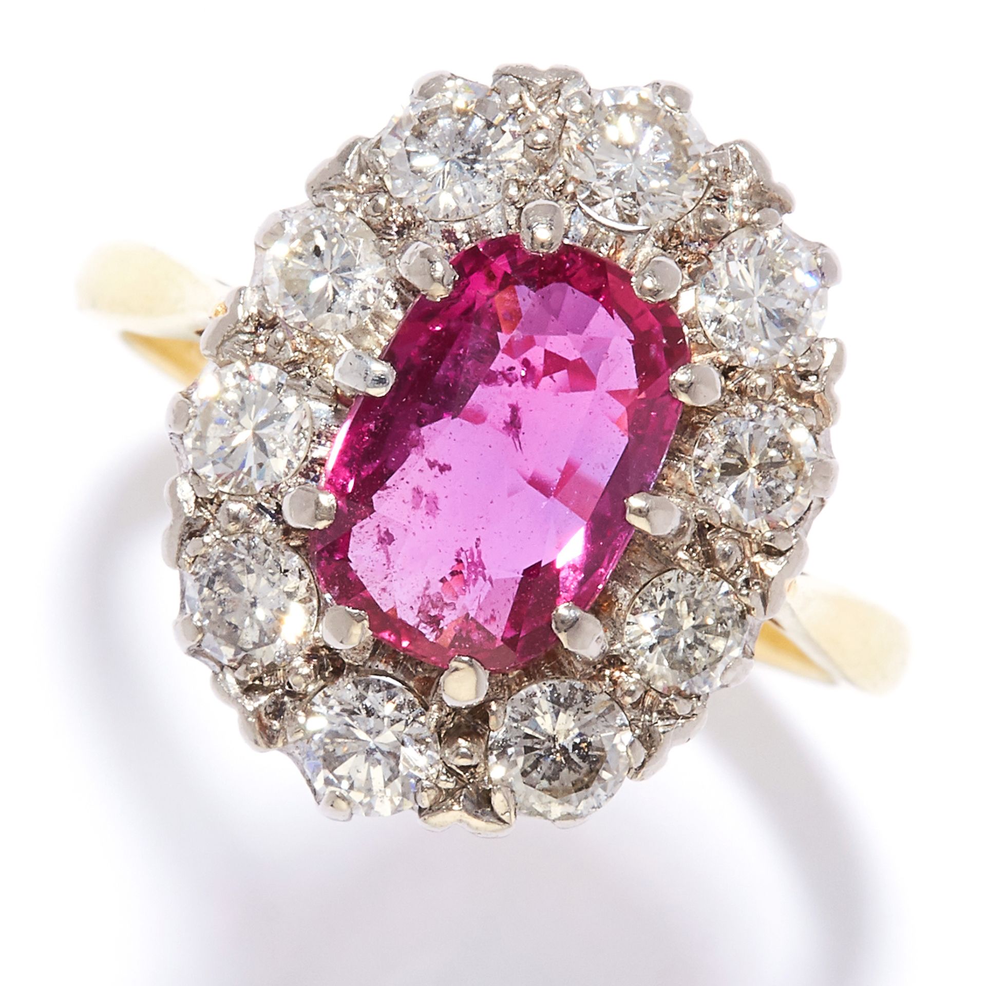 A 3.02 CARAT RUBY AND DIAMOND CLUSTER RING in 18ct yellow gold, designed as a 3.02 carat ruby set in