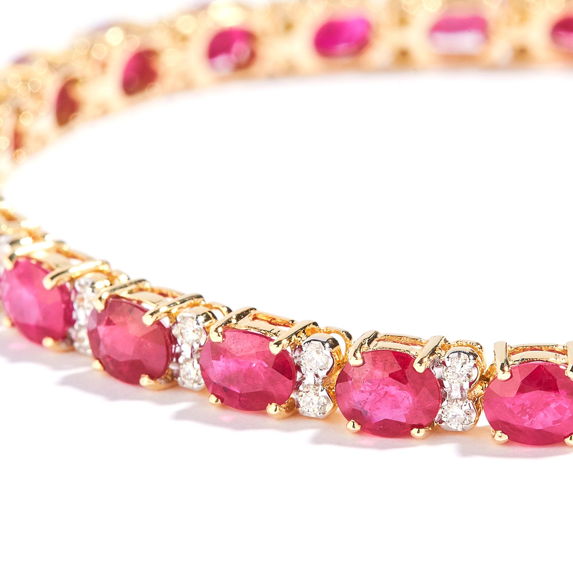 RUBY AND DIAMOND LINE BRACELET in 18ct yellow gold, set with oval cut rubies totalling approximately - Bild 2 aus 2