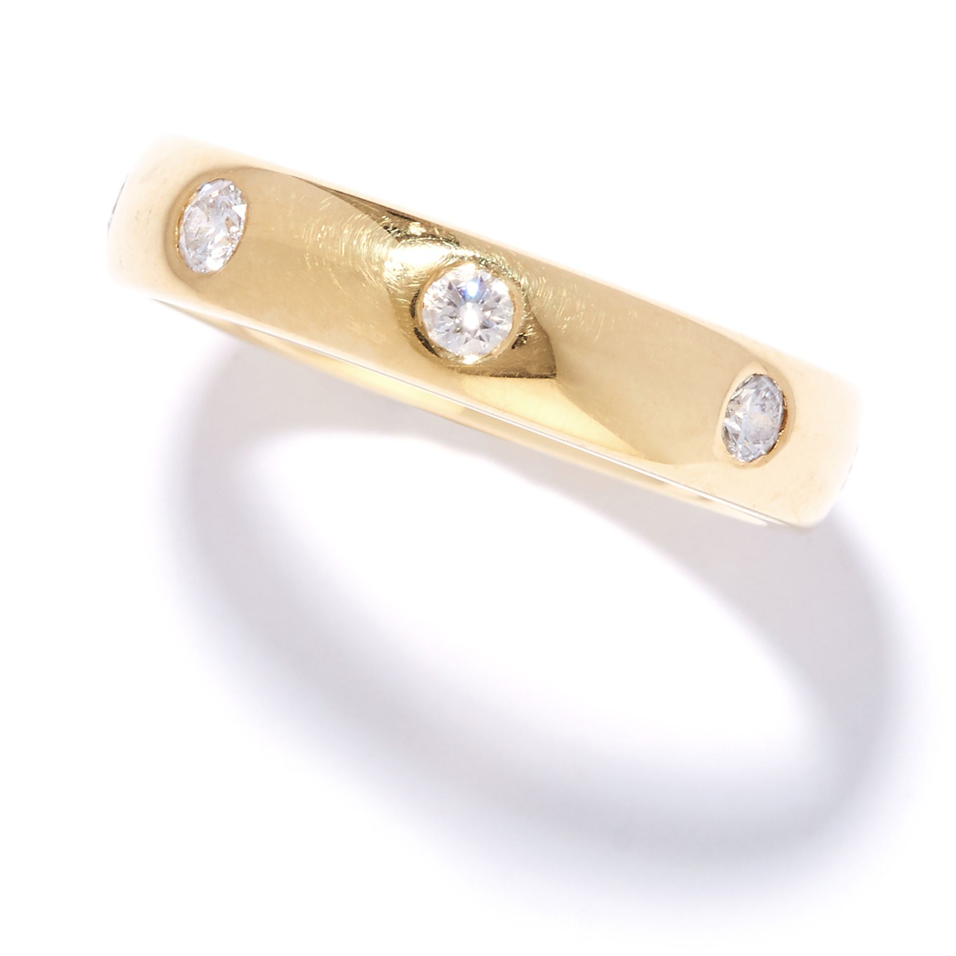 DIAMOND ETERNITY BAND RING in 18ct yellow gold, set with eight round cut diamonds, British