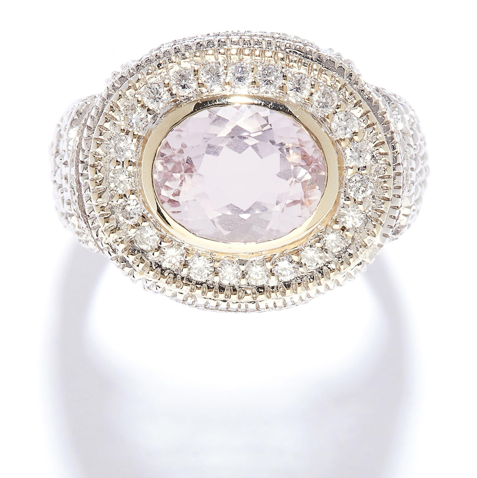 KUNZITE AND DIAMOND RING in white gold, the 2.45 carat oval cut kunzite accented by borders of