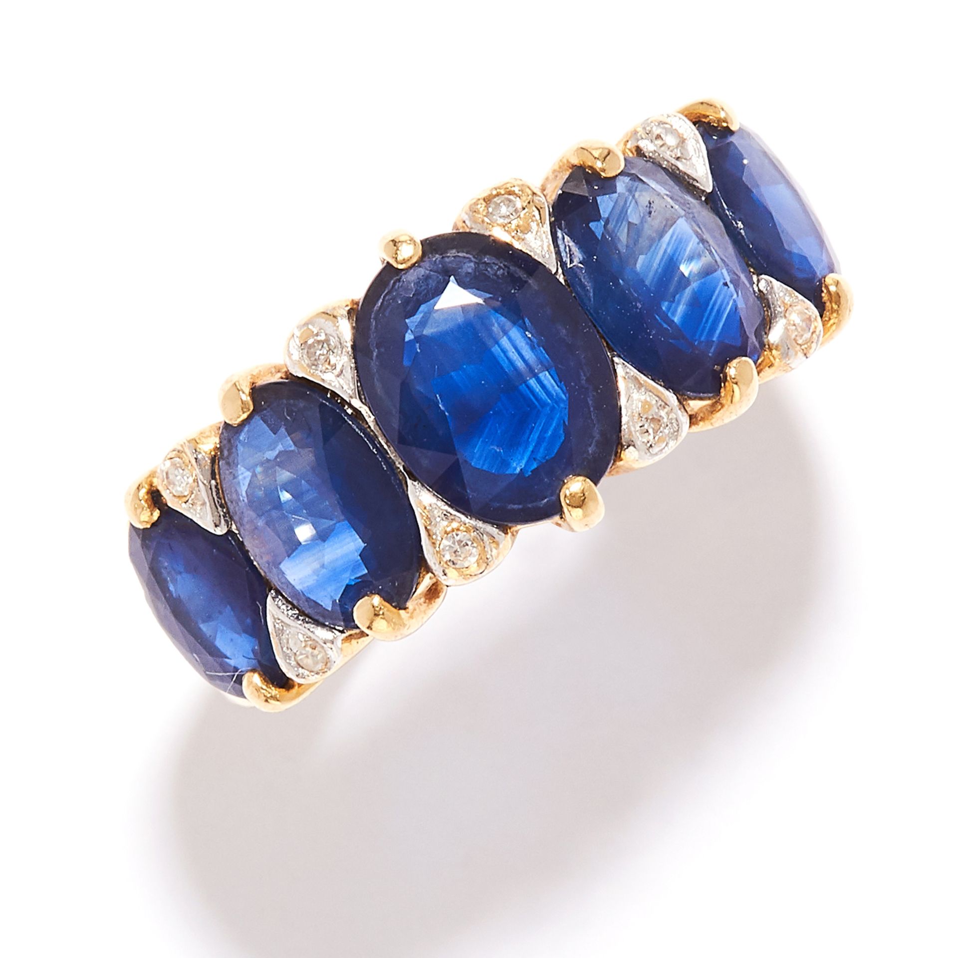 SAPPHIRE AND DIAMOND RING in high carat yellow gold, set with a row of five graduated oval cut