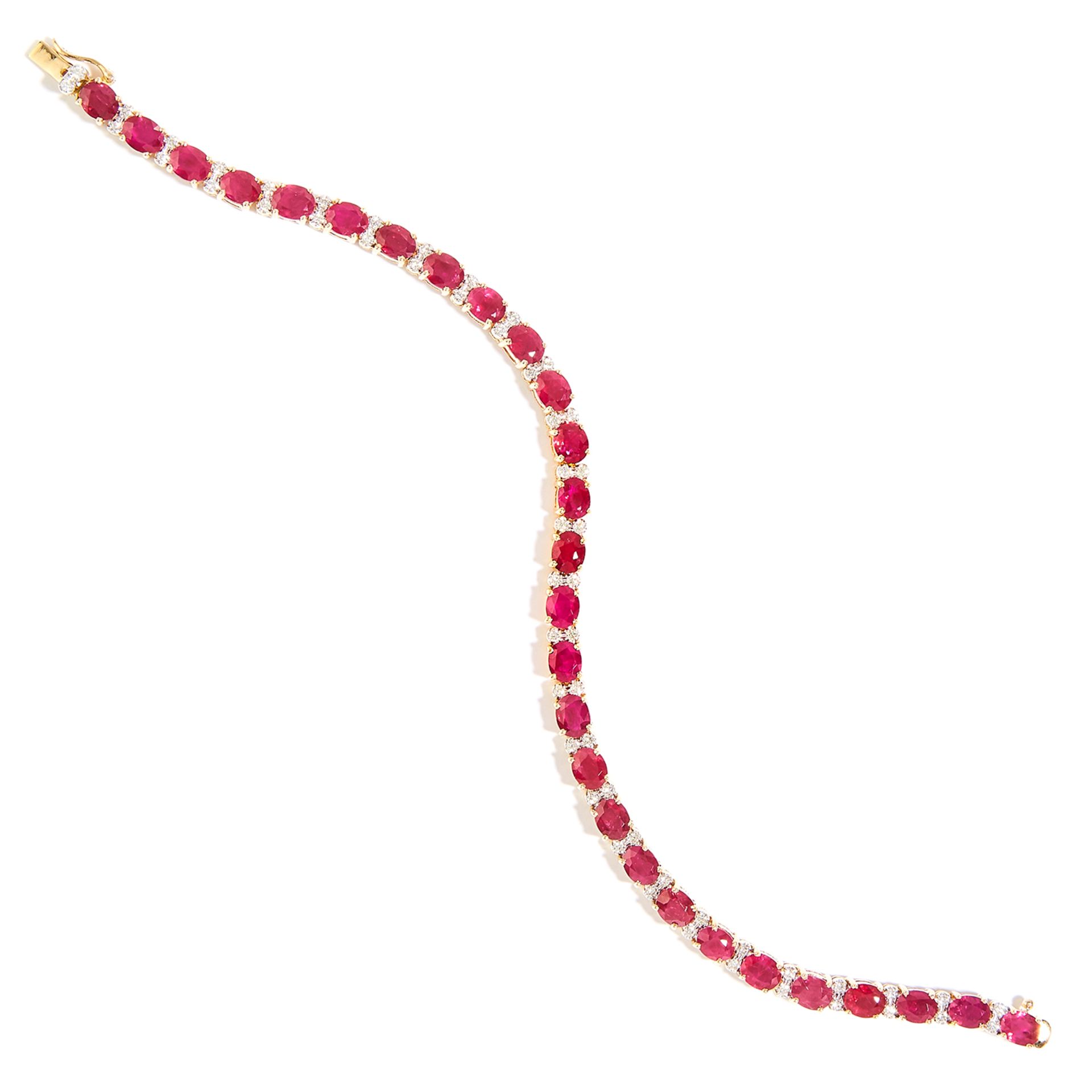 RUBY AND DIAMOND LINE BRACELET in 18ct yellow gold, set with oval cut rubies totalling approximately