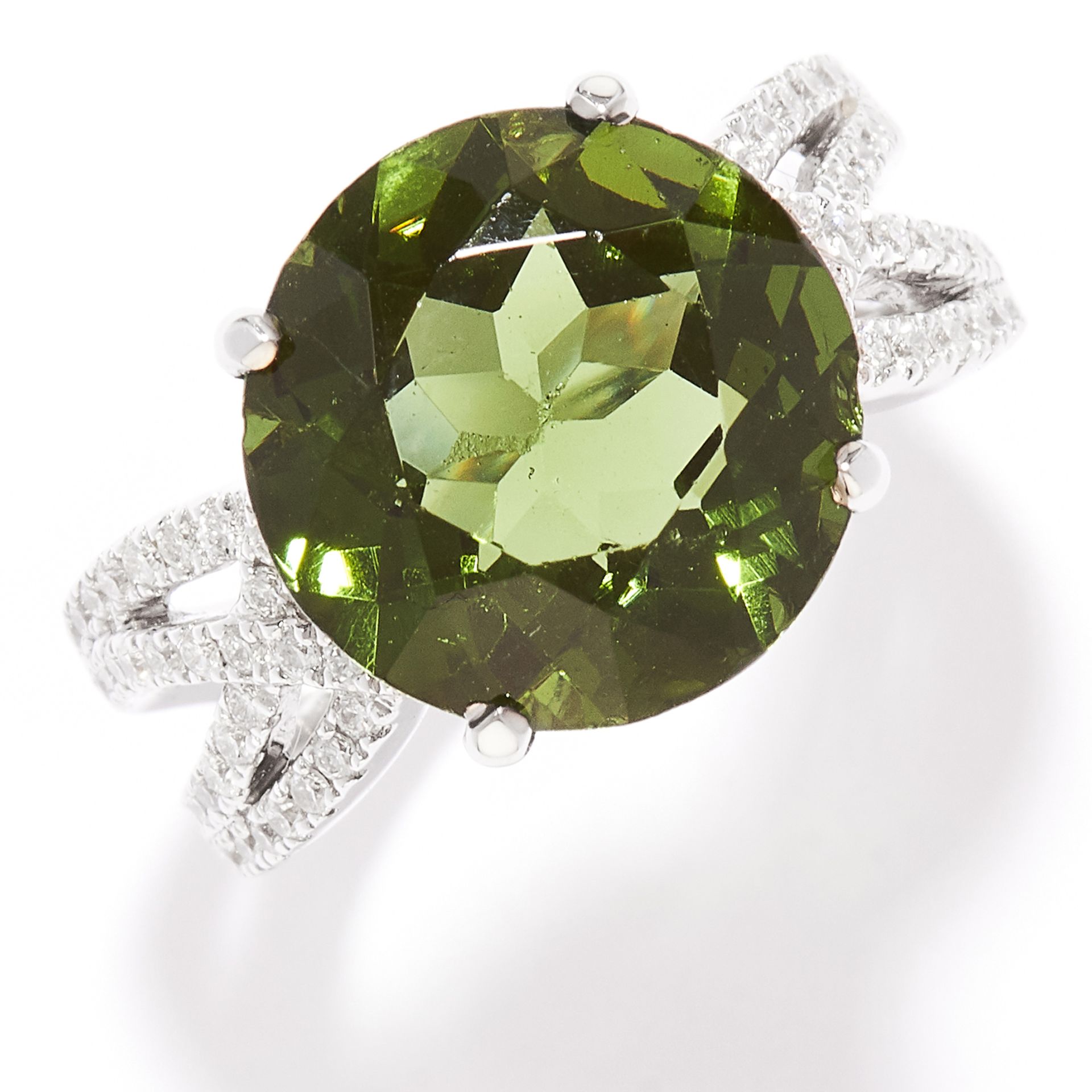 TOURMALINE AND DIAMOND DRESS RING in 18ct white gold, set with a round cut green tourmaline and